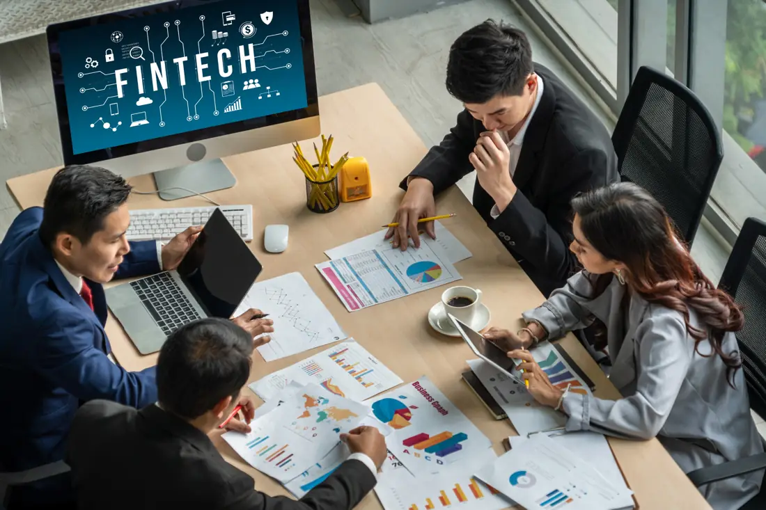 Fintech marketing team collaborating in a strategy session