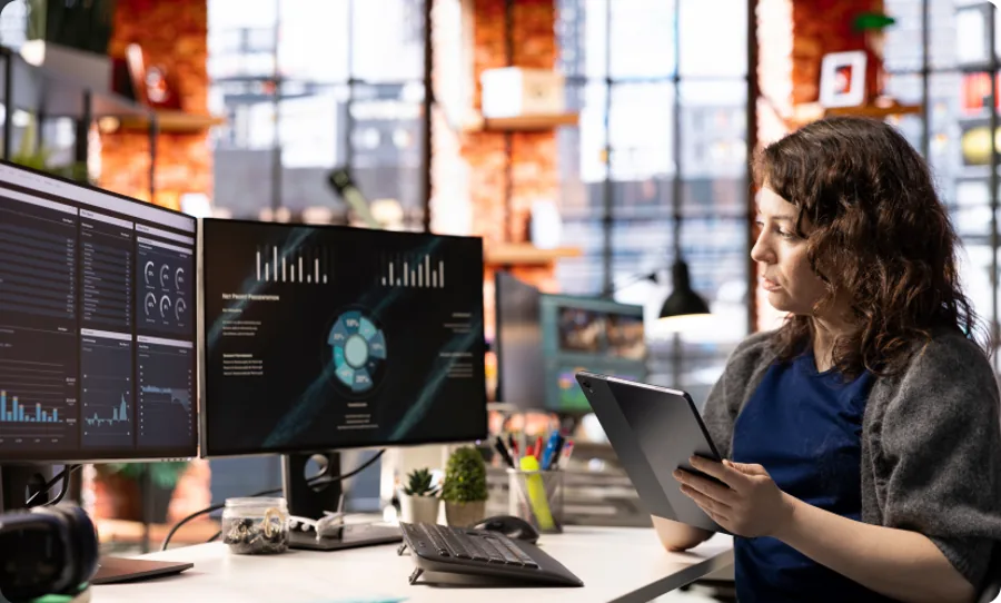 Analyst reviewing AI-driven sales dashboards