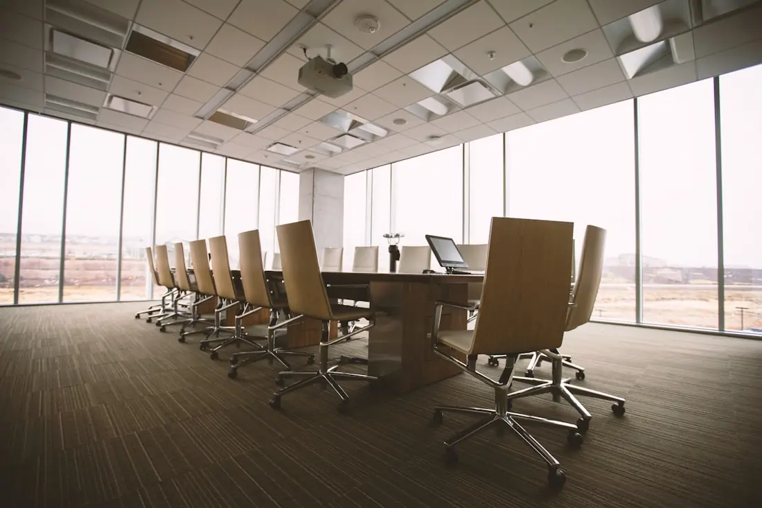 An empty boardroom set up for a session