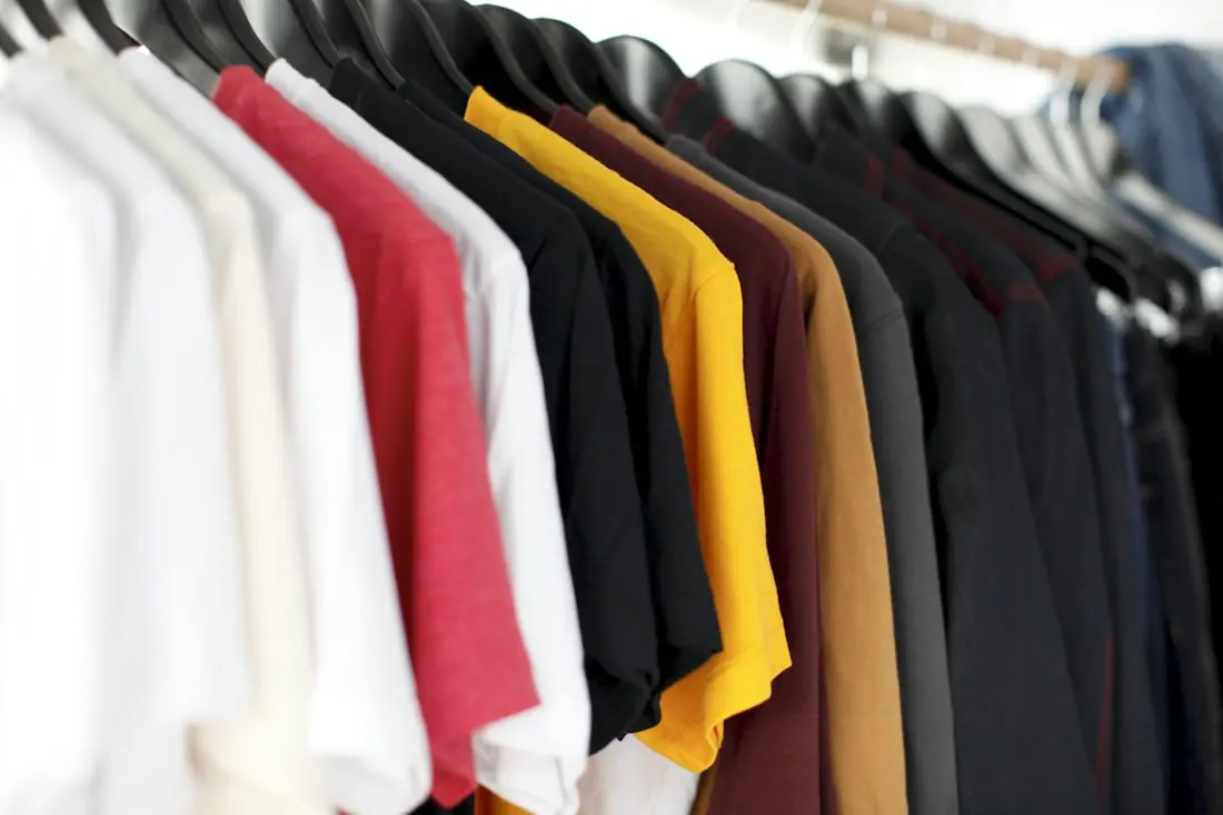 A rail of apparel in a retail showroom