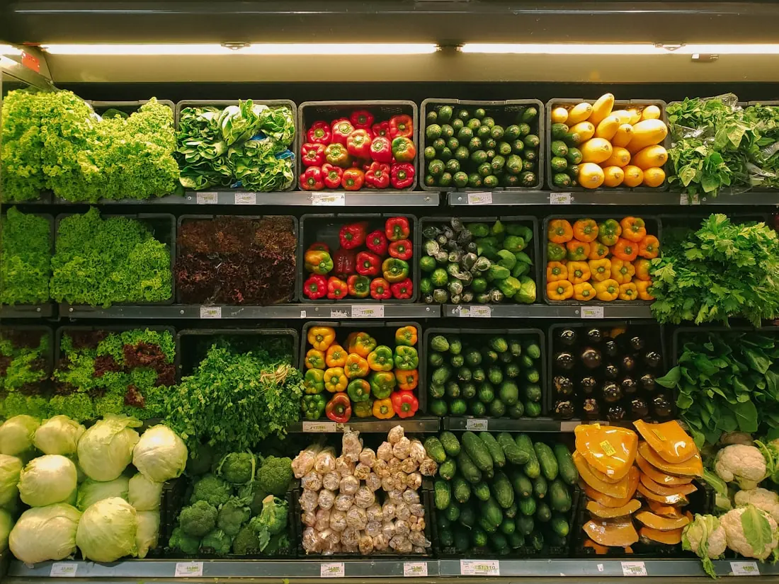 Fresh produce arranged on grocery shelves