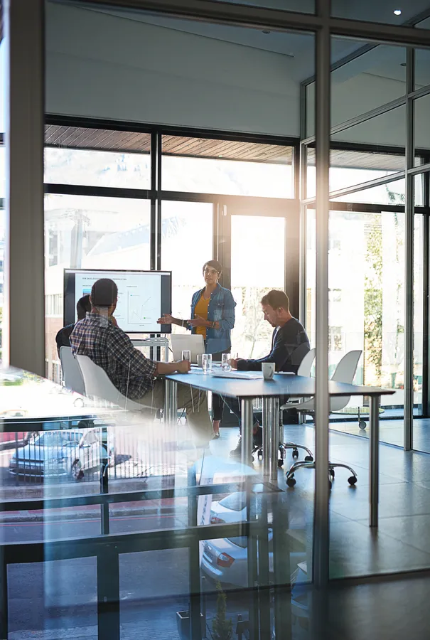 Strategy session in a glass meeting room