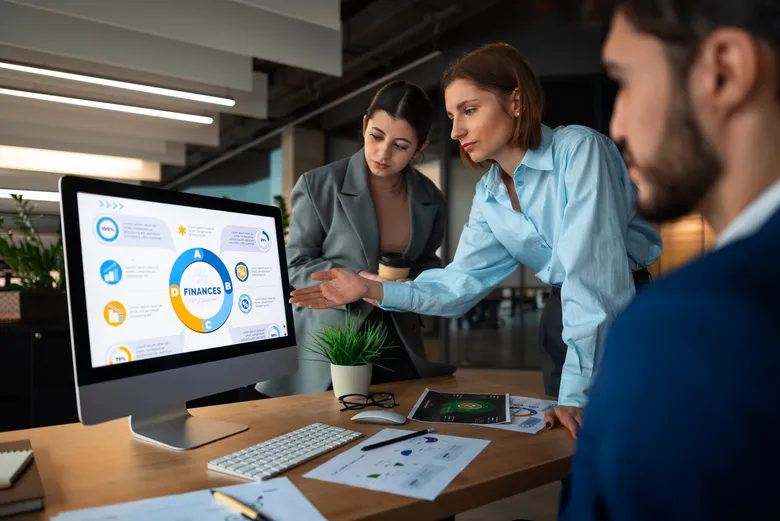 Marketing team reviewing a live analytics dashboard together
