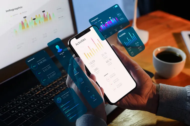 Marketer reviewing automation dashboards on a phone